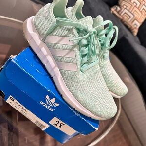Green addidas sneakers